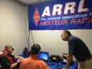 ARRL Puerto Rico Section Manager Oscar Resto, KP4RF, consults with two ham radio volunteers at American Red Cross Headquarters in San Juan.